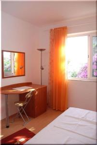 Posteľ alebo postele v izbe v ubytovaní Apartmani Ivić Paka Rab