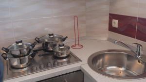 Kuchyňa alebo kuchynka v ubytovaní Apartmani Ivić Paka Rab