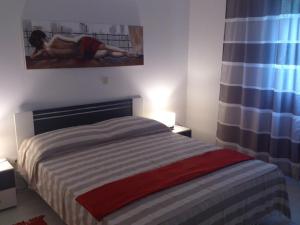 Posteľ alebo postele v izbe v ubytovaní Apartmani Ivić Paka Rab