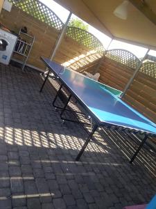 a ping pong table in front of a bench at Niezapominajka Kopalino in Kopalino