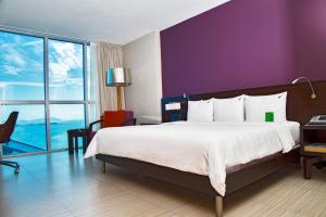 Cama ou camas em um quarto em Megapolis Hotel Panama
