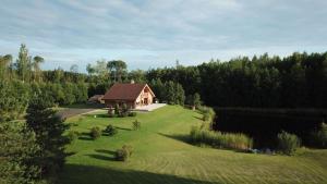 an aerial view of a house in a field at Bērzi in Turkalne