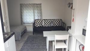 Posezení v ubytování Punavilla Cottage