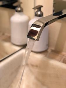 a faucet with water coming out of it at Magnolias Boutique Suites & SPA in San Cristóbal de Las Casas