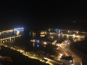 an airport lit up at night with lights at Al-marsa2 in Al Hoceïma