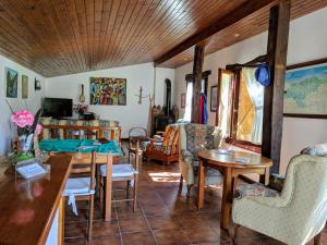 a living room with a table and chairs at Posada La Merced in Loredo