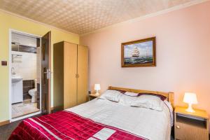 Postel nebo postele na pokoji v ubytování Dom Gościnny Marcela