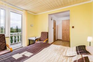 Postel nebo postele na pokoji v ubytování Dom Gościnny Marcela
