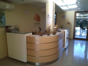 a lobby with a reception desk in a building at Private Apartment A12 in July Morning Seaside Resort in Kavarna