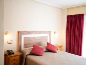 Postel nebo postele na pokoji v ubytování Hotel Quino