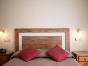 Postel nebo postele na pokoji v ubytování Hotel Quino