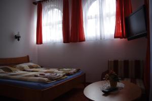Postel nebo postele na pokoji v ubytování Horváth Kert Vendégház