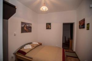 a bedroom with a bed in a room at Vinarija Andjusic in Dračevo