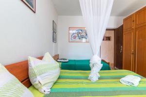 Posteľ alebo postele v izbe v ubytovaní Apartment Sanka