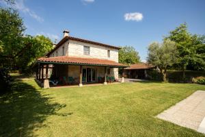 a house with a large yard in front of it at Quinta do Castelo in Arcos de Valdevez