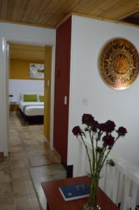 Postel nebo postele na pokoji v ubytování Hotel Casa Normandia