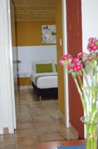 Postel nebo postele na pokoji v ubytování Hotel Casa Normandia