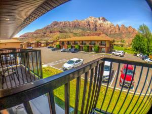 a view of a parking lot with a mountain in the background at Bumbleberry Inn in Springdale