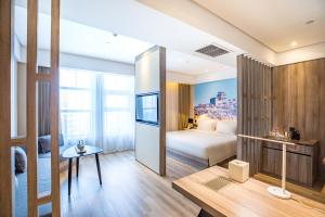 Katil atau katil-katil dalam bilik di Atour Hotel Weifang Jinma Road City Hall