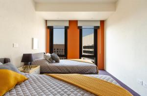 Voodi või voodid majutusasutuse Miyana Boutique Apartment toas