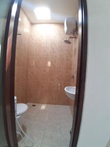 a bathroom with a toilet and a sink at D&D homestay in Pesanggaran +21 photos