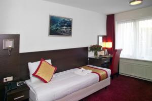 Postel nebo postele na pokoji v ubytování Hotel Allure