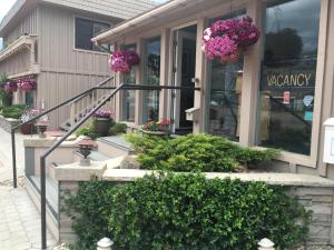 a store with flowers in the window of a building at Woodland Motel in Salida