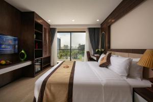Postel nebo postele na pokoji v ubytování Marina Hotel Ha Noi + 37 fotografií