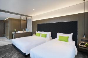 Postel nebo postele na pokoji v ubytování Hotel Ease Tsuen Wan