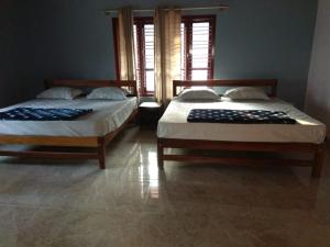 Ένα ή περισσότερα κρεβάτια σε δωμάτιο στο Leela Farm Stay - Exclusive for Group Stay