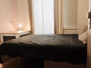 Un ou plusieurs lits dans un hébergement de l'établissement Villa Tarbis Tarbes centre ville , appartements tout confort
