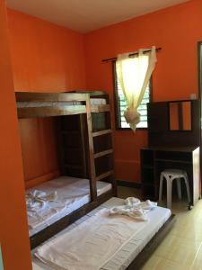 Postel nebo postele na pokoji v ubytování Panglao Rainbow Inn