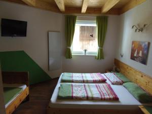 Postel nebo postele na pokoji v ubytování Schattaugut + 36 fotografií