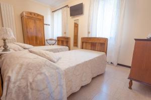 Postel nebo postele na pokoji v ubytování AgriB&B Corte Burchio