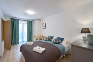 Ένα ή περισσότερα κρεβάτια σε δωμάτιο στο Villa Ventus