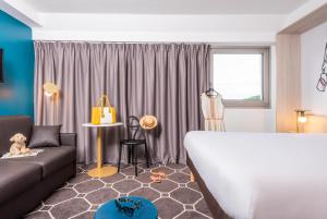 Postel nebo postele na pokoji v ubytování ibis Styles Sceaux Paris Sud