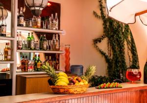 a basket of fruit on a counter in a bar at Lancaster Tamar Hotel- Hadath in Beirut