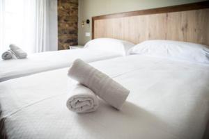 Łóżko lub łóżka w pokoju w obiekcie Hotel portico