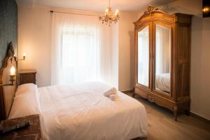 Łóżko lub łóżka w pokoju w obiekcie Hotel portico