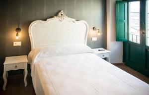 Łóżko lub łóżka w pokoju w obiekcie Hotel portico