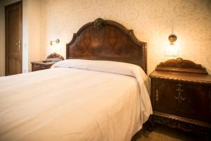 Łóżko lub łóżka w pokoju w obiekcie Hotel portico