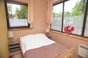 Postel nebo postele na pokoji v ubytování Apartament Poddąbie + 23 fotografií