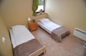 Postel nebo postele na pokoji v ubytování Apartament Poddąbie