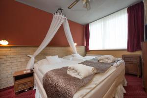 Postel nebo postele na pokoji v ubytování Hotel Therma Dunajská Streda