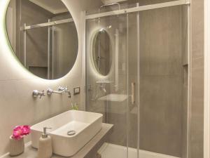 a bathroom with a sink and a glass shower at Campanili di Puglia B&B in Andria +50 photos