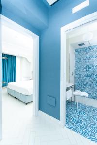 Postel nebo postele na pokoji v ubytování Hotel Club Due Torri