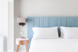 Postel nebo postele na pokoji v ubytování Hotel Club Due Torri