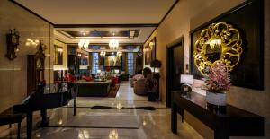 a lobby with a living room and a living room at Epoque Hotel - Relais & Chateaux in Bucharest