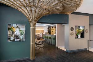 a dining room with a large gold ceiling at Vincci Selección Posada del Patio in Málaga