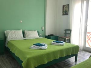 A bed or beds in a room at Studios Panorama Drios